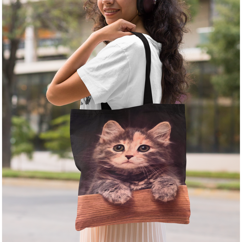 Cat Looking Over Wall Tote Bag